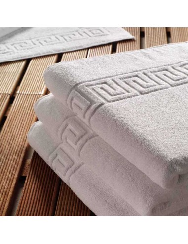 Toalla de lavabo blanca con greca en...